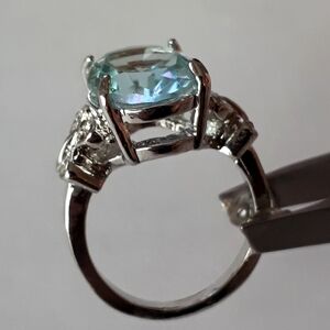 Pretty silver-plated size 7 ring with large ice blue crystal stone